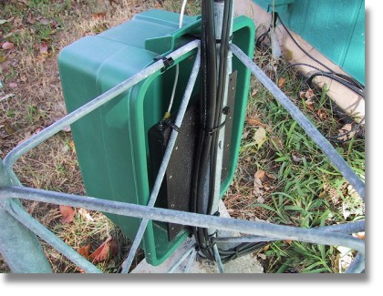 Photo of SG-237 at Base of Tower (at old QTH) Under a Rubbermaid container to prevent Hail Damage